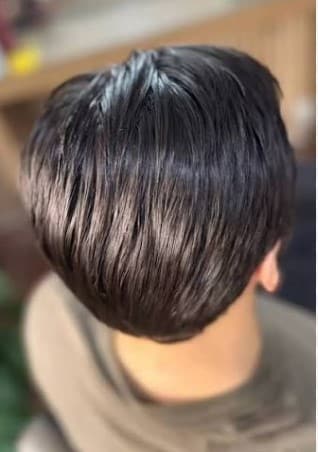 Cabelo alinhado após progressiva na Barbearia Executive